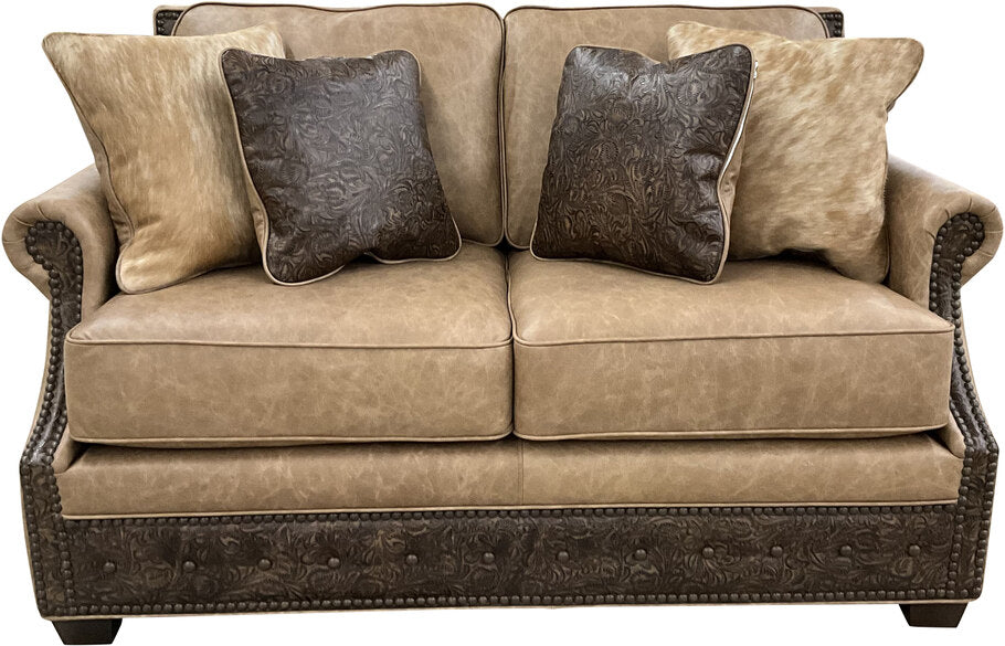 The El Dorado Loveseat in Palio Camel leather with Floral Bone Black accents, featuring rolled arms and a sleek Western-inspired design for timeless elegance.