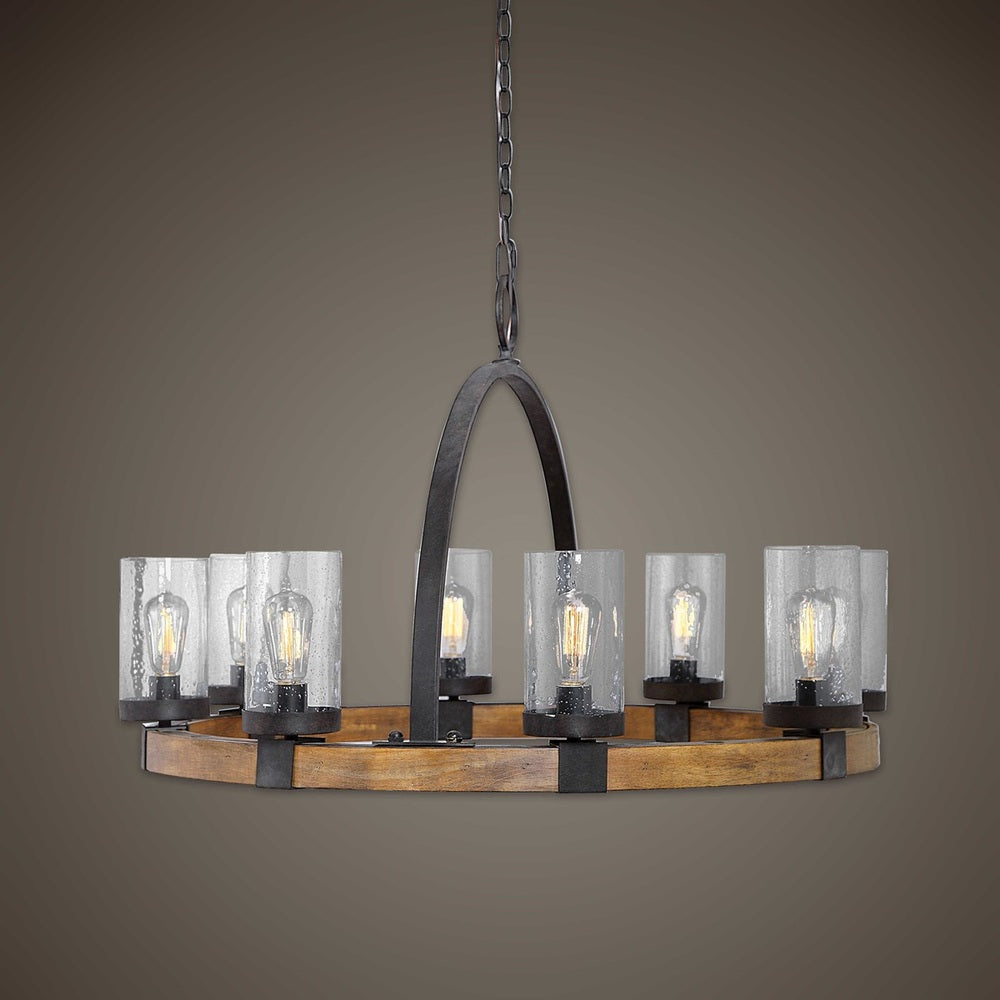 El Wood chandelier with clear seeded glass shades, eight Edison bulb sockets, and a large circular hook for a rustic industrial look.
