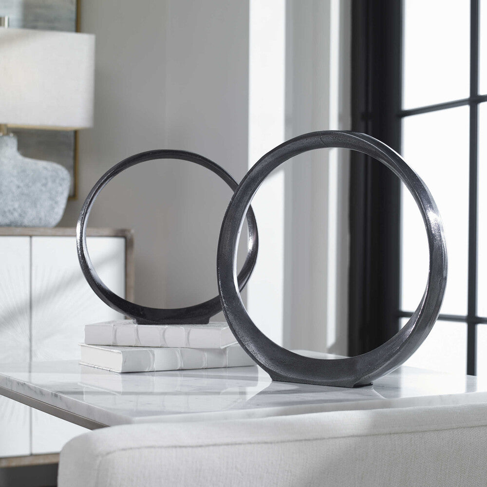 Elegant black nickel Loop Ring Sculpture showcasing its minimalist and modern aesthetic.