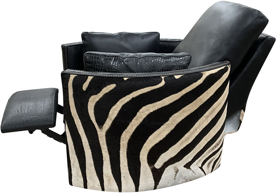 Side profile of the Exotic Zebra Swivel Recliner highlighting the gracefully curving arms and the seamless integration of Fendi Night leather with black gator leather accents.