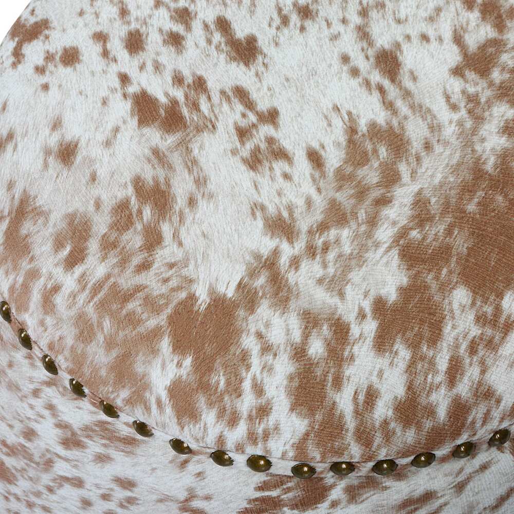 Stylish ottoman upholstered in chestnut and white faux cowhide, ideal for seating or foot.