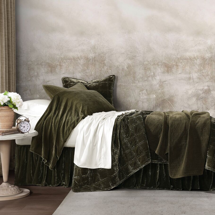 Fern Green Faux Silk Velvet Quilt Set featured in a rustic bedroom, blending seamlessly with wooden accents and earthy elements.