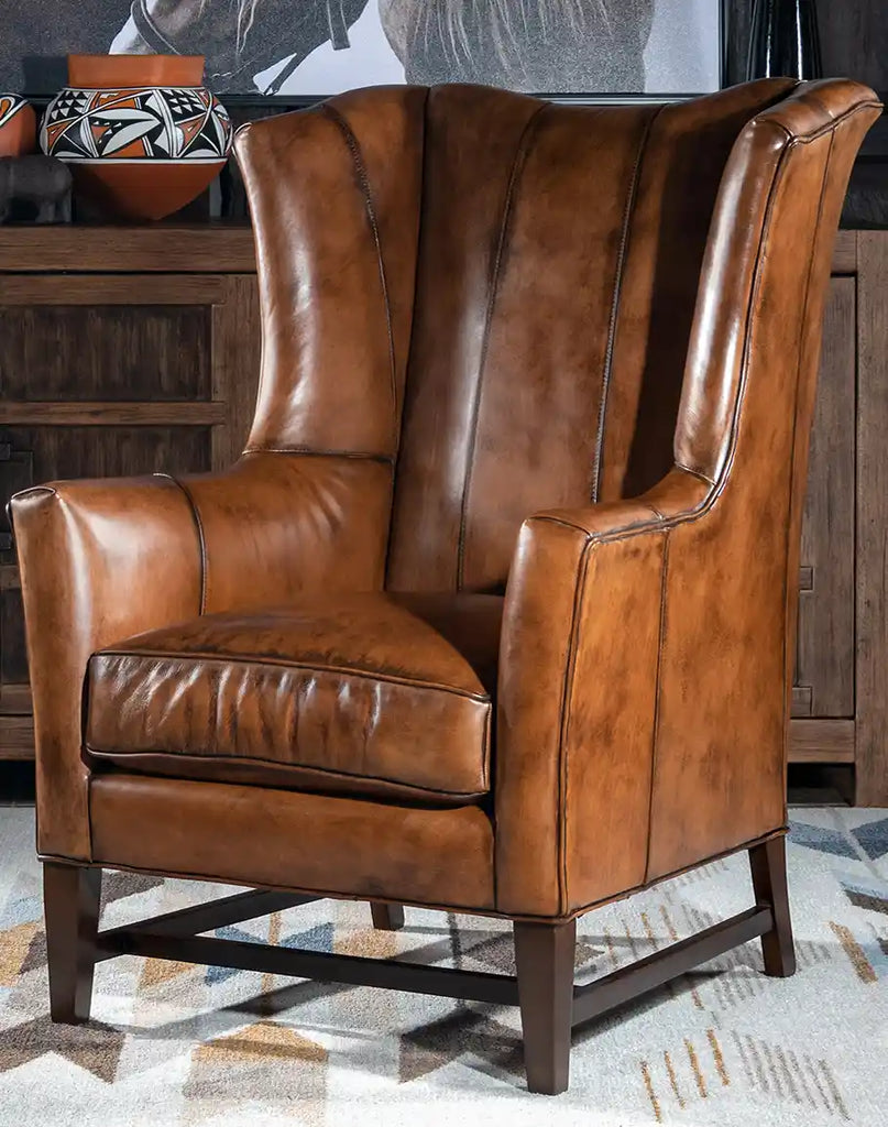 Ganesha Leather Chair, showcasing its elegant wingback design and genuine leather upholstery.