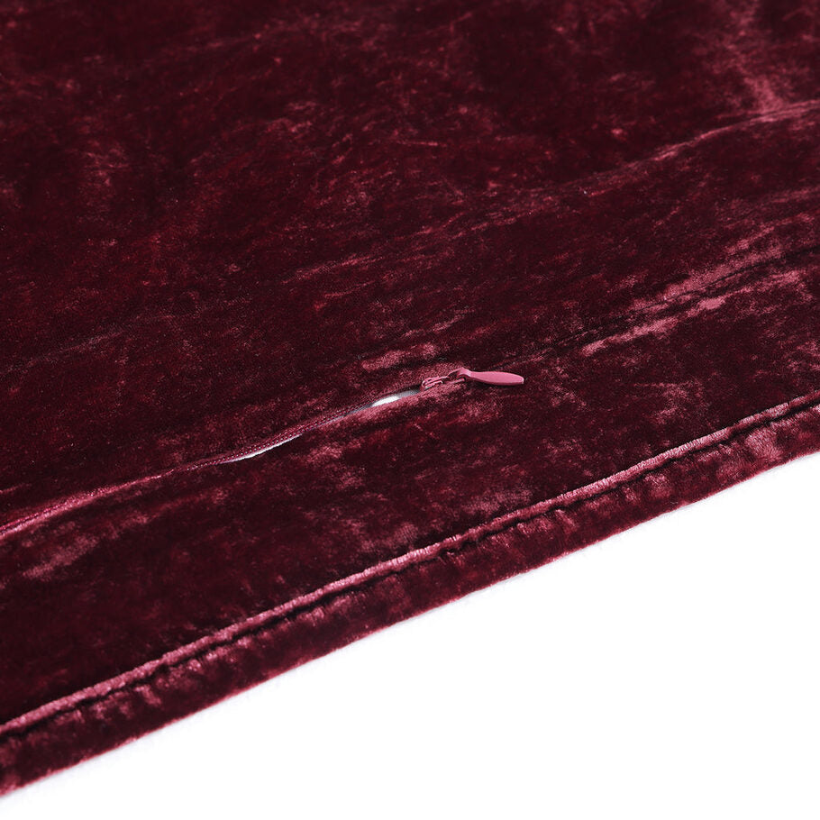 Close-up showcasing the smooth, faux silk velvet fabric of the Garnet Red Quilt, offering a luxurious feel and subtle sheen.