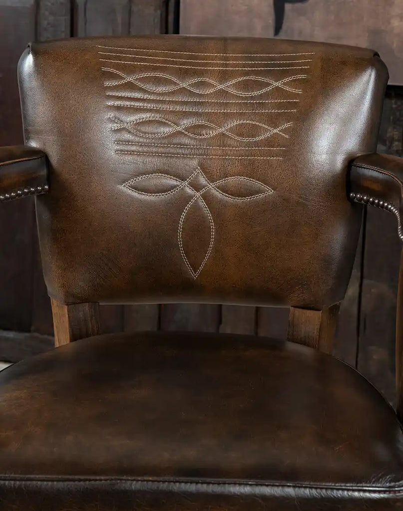 Generously padded leather seat offering exceptional comfort and style for any setting.