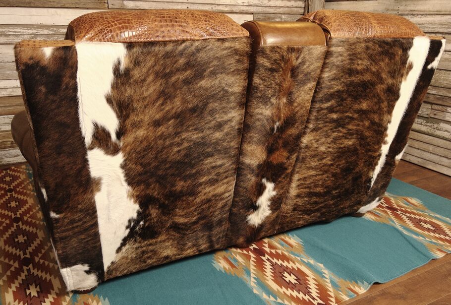 Detailed close-up of the genuine Brazilian cowhide on the Giovanni Theater Reclining Love Seat, featuring an exotic dark brindle pattern for a sophisticated touch.