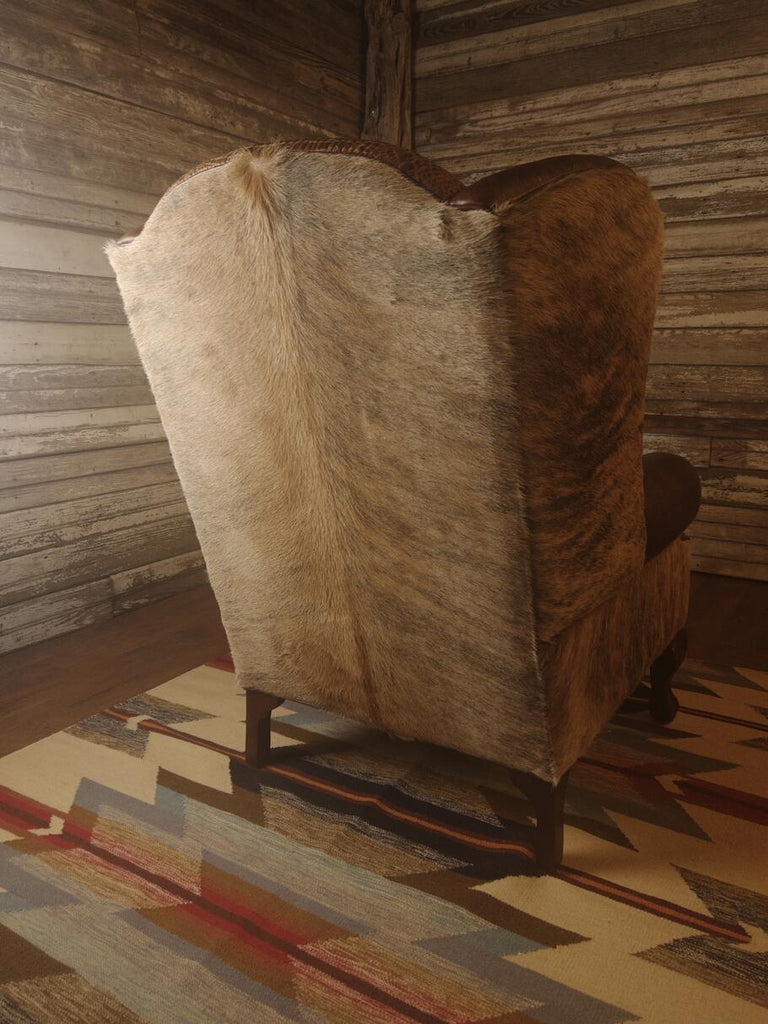 Back view of the Giovanni Wingback Chair highlighting the light exotic brindle Brazilian cowhide and the chair's refined silhouette.