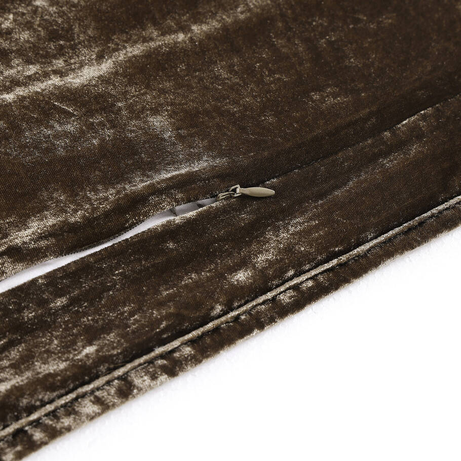 Close-up showcasing the smooth, faux silk velvet fabric of the Green Ochre Quilt, offering a luxurious feel and subtle sheen.