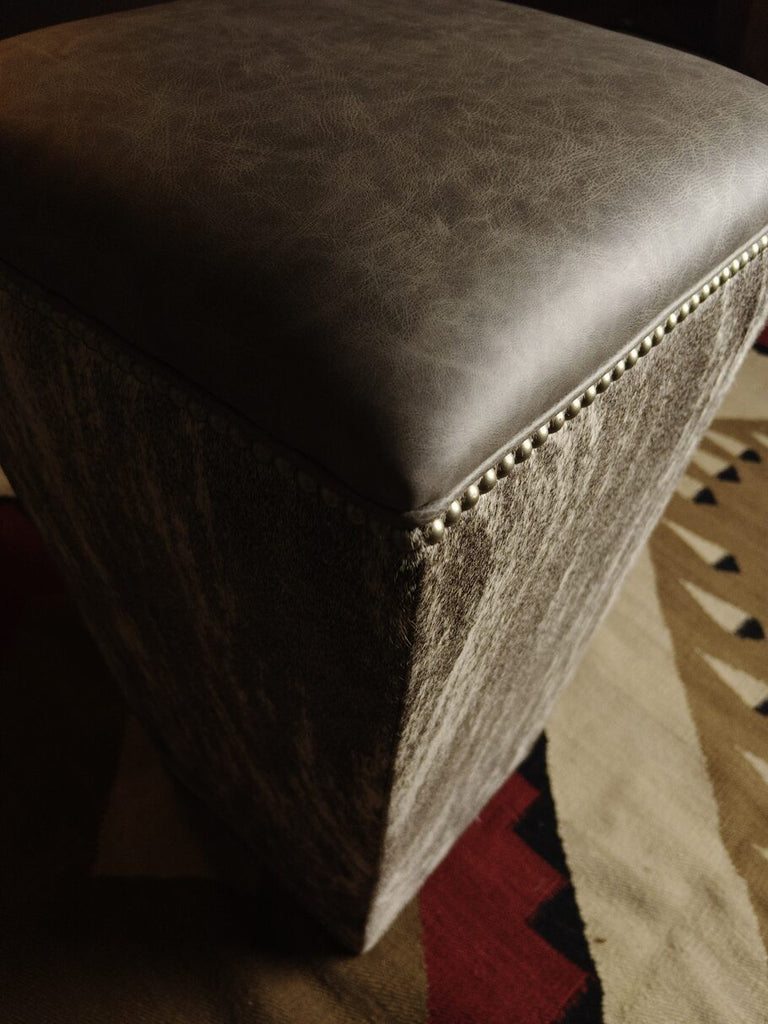 Detailed view of the Greystone Barstool’s Saloon Fossil leather seat, showcasing its premium texture and luxurious finish.