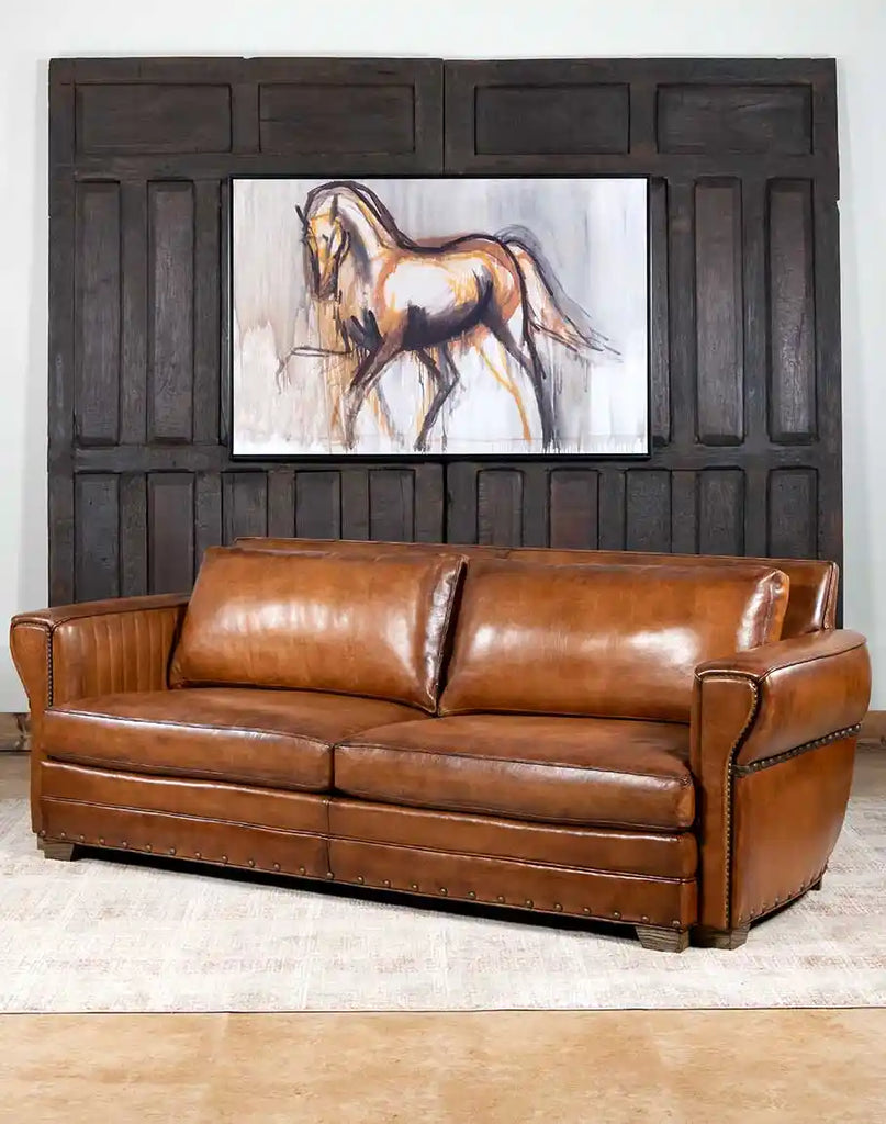 Herdsman Leather Sofa showcasing a modern rustic aesthetic, while maintaining impeccable comfort and durability. 