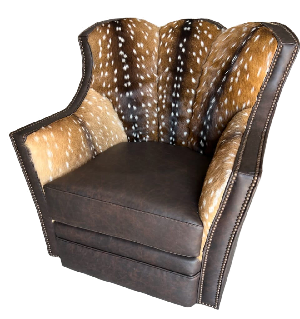 Chair with axis deer skin pattern on the backrest and brown leather seat and armrests.