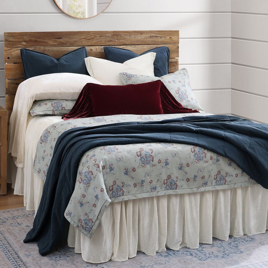 Queen-sized Isabelle Washed Denim Bedding Set featuring floral patterns in blue, red, and sage on a soft denim background.