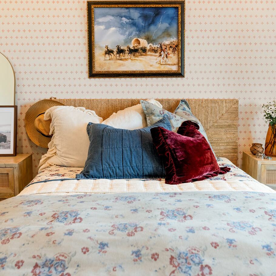 Isabelle Washed Denim Bedding Set featuring floral patterns in blue, red, and sage on a soft denim background.