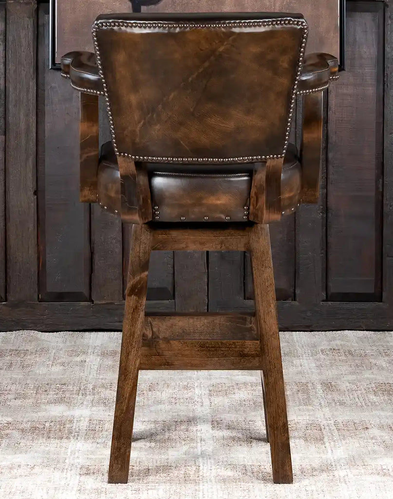 Back view of the Lamar County Brown Barstool showcasing the intricate boot stitch design on the leather backrest and brass nailhead trim along the edges.