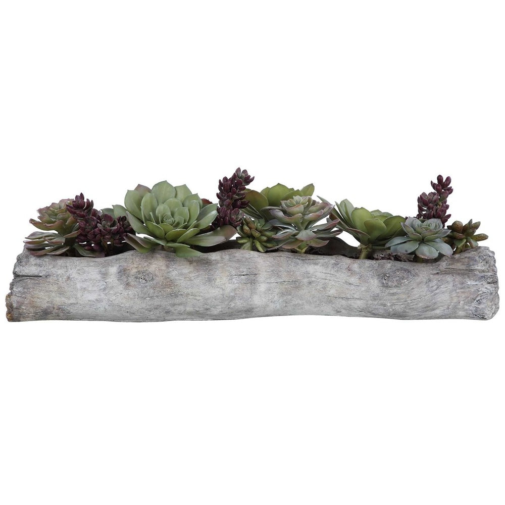 Lifelike green and burgundy succulents arranged in a driftwood-inspired solid concrete planter.