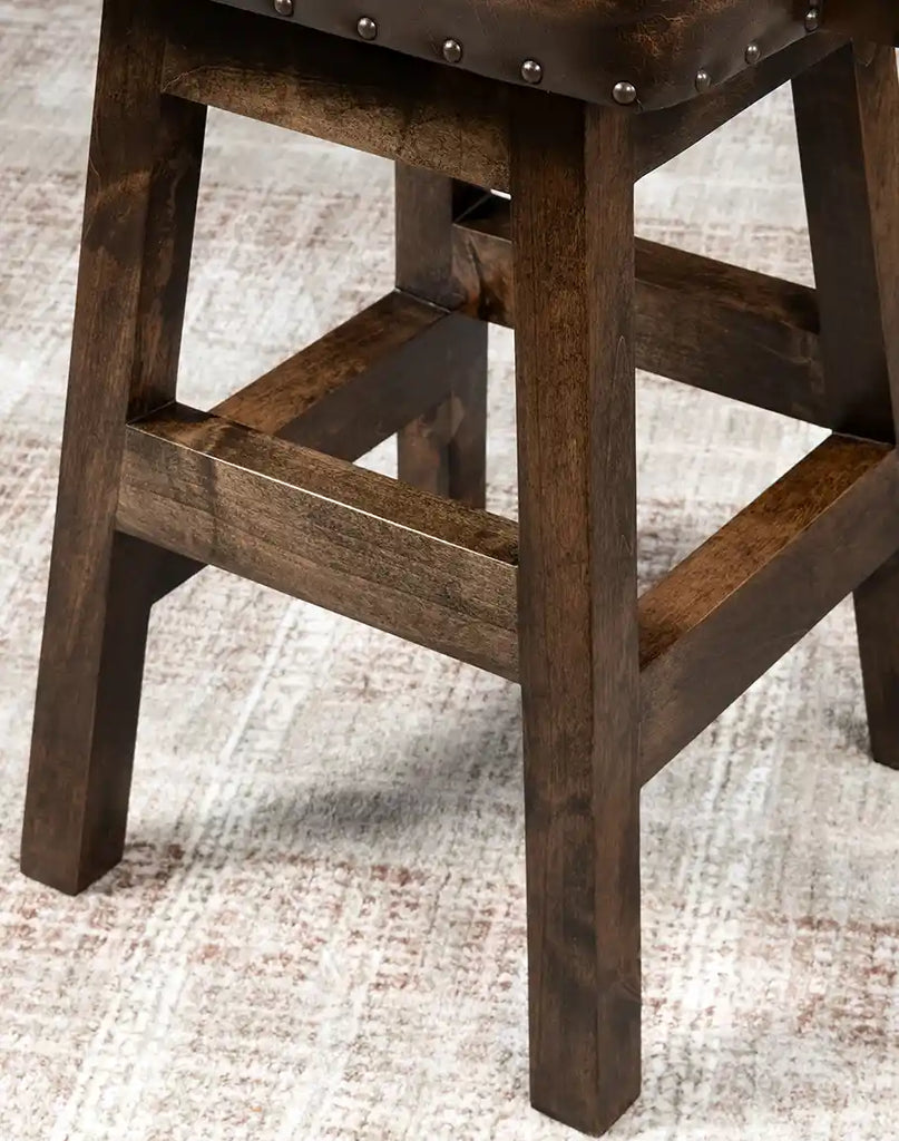 Richly stained alder wood legs providing sturdy support and a timeless aesthetic.