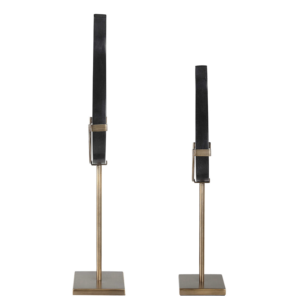 Set of two handcrafted Black Flame sculptures, perfect for modern decor with black stone and brass accents.