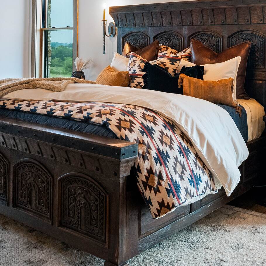 Marina Chenille Bedding Set showcasing bold Aztec-inspired patterns in red, tan, blue, and brown hues.​