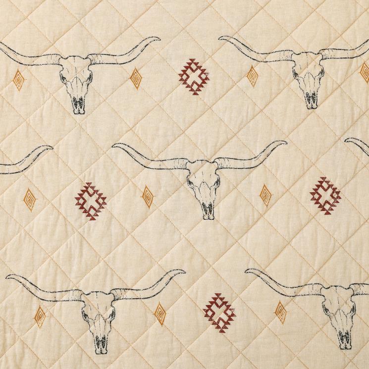 Close-up of the quilt highlighting the detailed Texas Longhorns and traditional Western motifs in earthy tones.