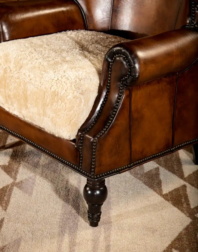 Detailed image showcasing the luxurious shearling hide seat cushion, emphasizing the chair’s comfort and high-quality materials.