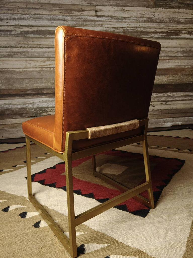 Back view of the Napa Valley Dining Chair, illustrating the seamless leather upholstery and sturdy frame.