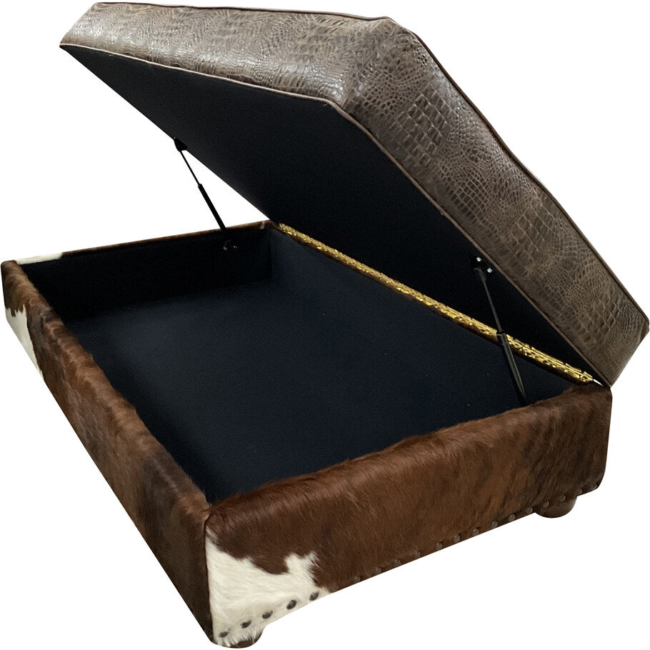 Side profile of the Palio Dark Brown Storage Ottoman highlighting the dark exotic with white brindle cowhide wrapping the bottom rail.