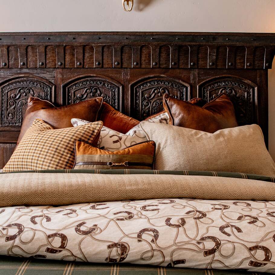 Prieto Equestrian Bedding Set paired with coordinating accessories, including decorative pillows and a throw blanket.