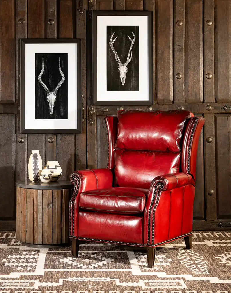 The Ruby Red Leather Recliner styled in a living room setting, blending seamlessly with various furniture styles for a sophisticated touch.