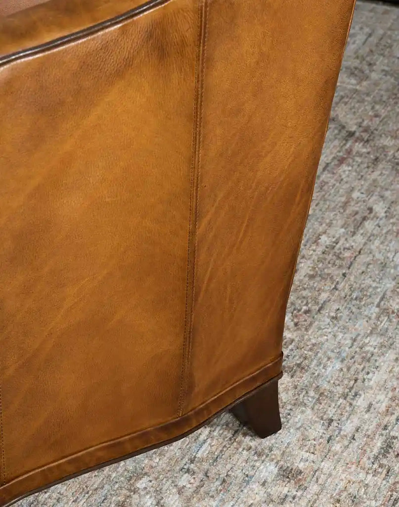 Detailed image showcasing the meticulous stitching on the Rudy Saddle Leather Sofa's leather upholstery.