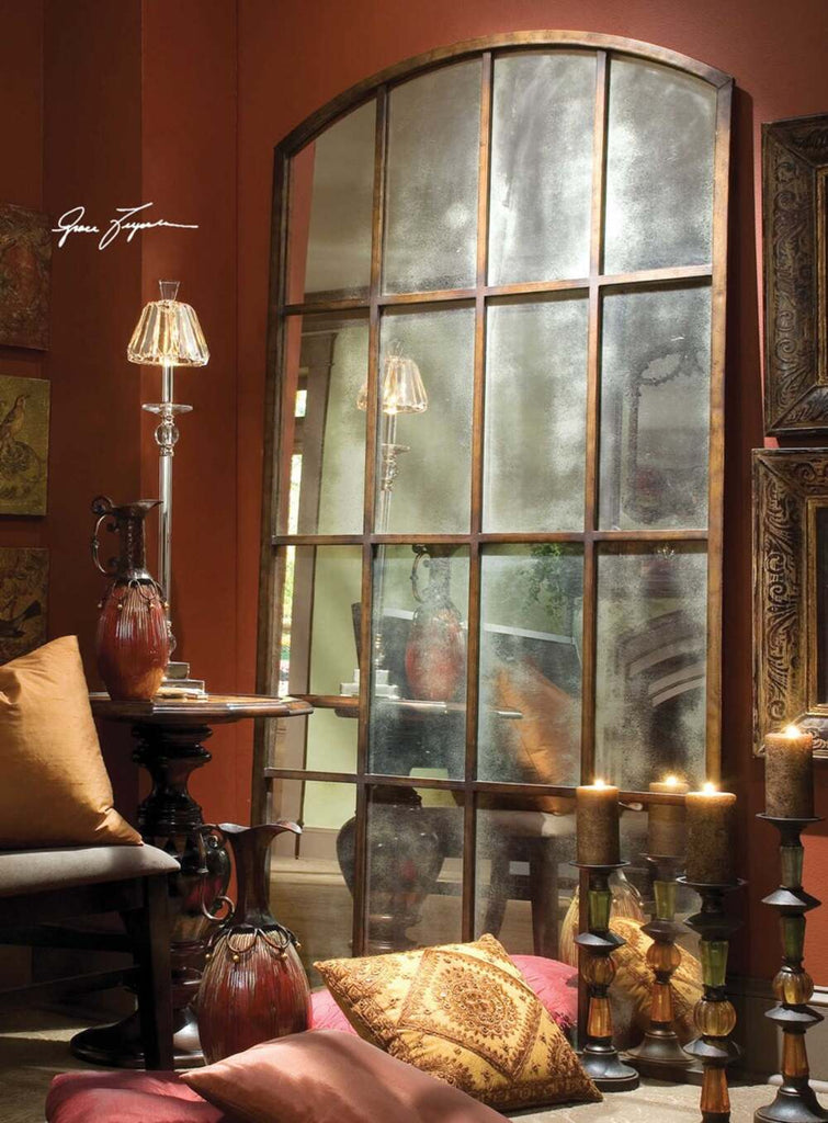 Large arched mirror resembling a classic window, made of forged iron with burnished bronze and distressed details.