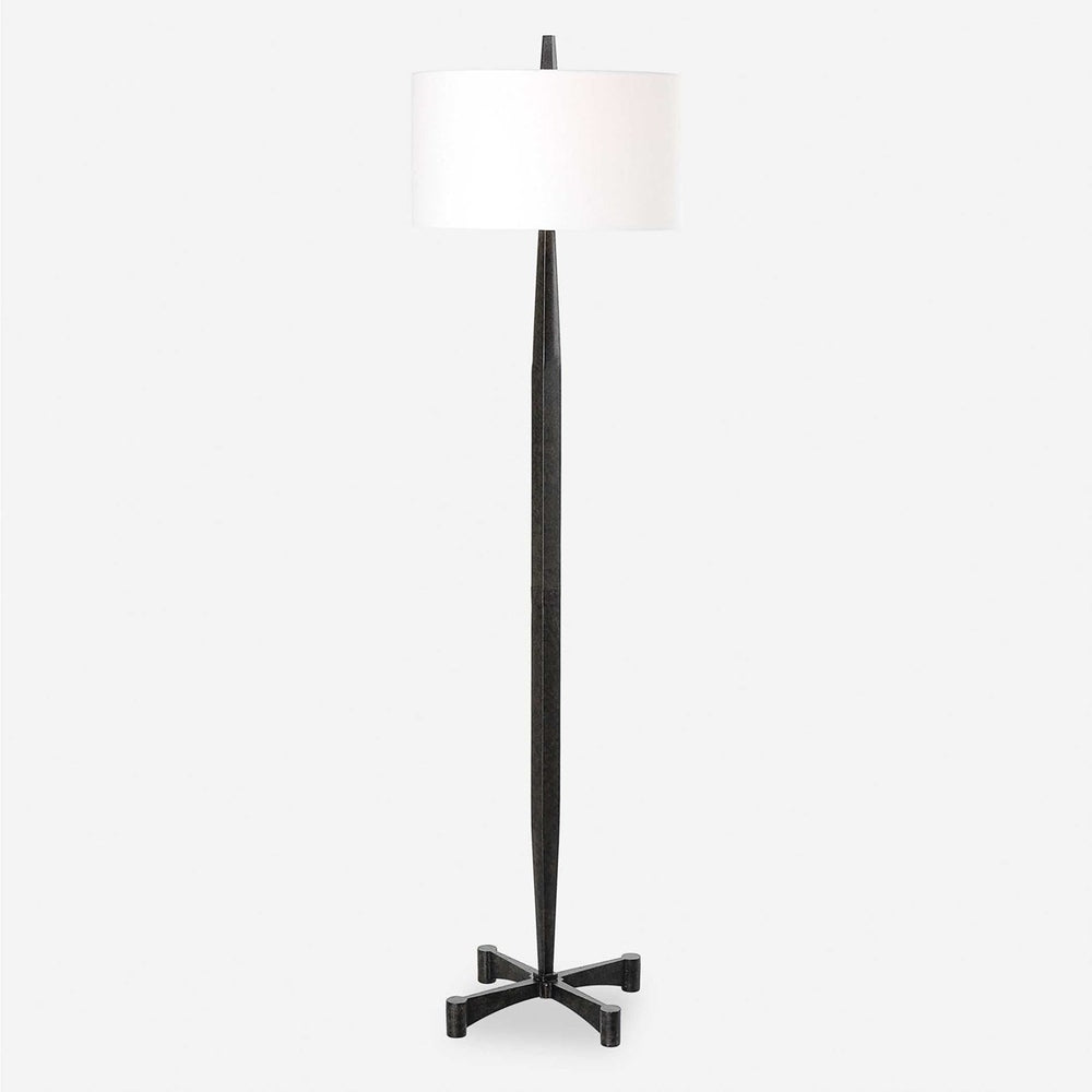 Rustic floor lamp with a tapered black metal base, rust details, and a white fabric shade.