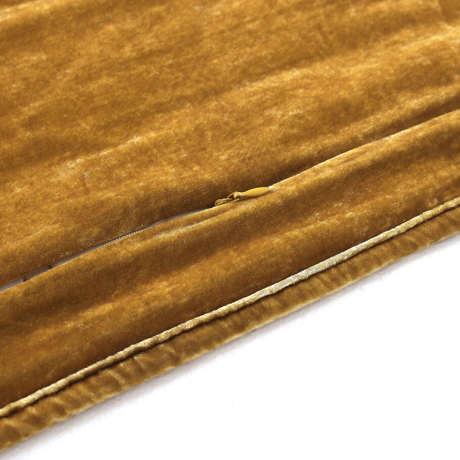  Close-up showcasing the smooth, faux silk velvet fabric of the Saffron Quilt, offering a luxurious feel and subtle sheen.