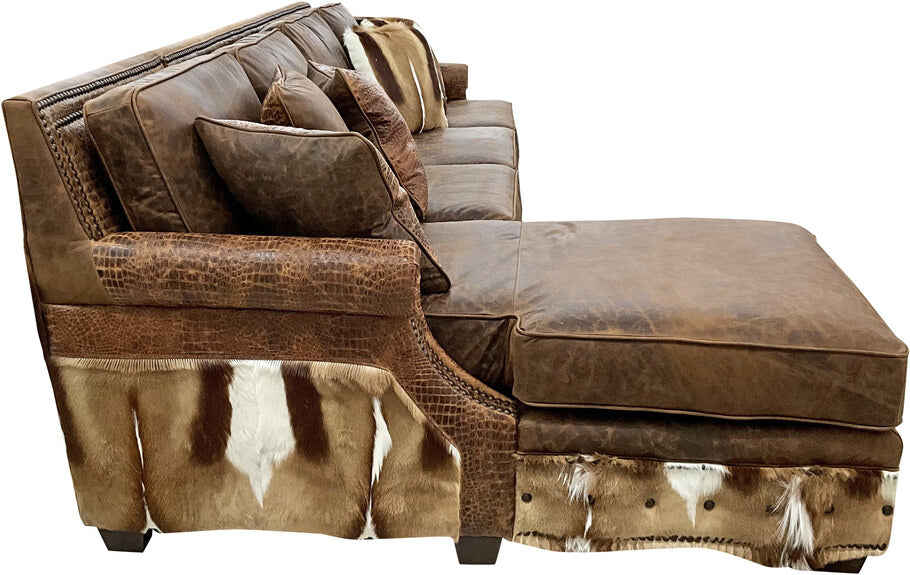 Side profile of the Sanaa Springbok Sectional Sofa highlighting the Springbok hides on the outside arms and Gator Hornback Rustic Cognac leather detailing.