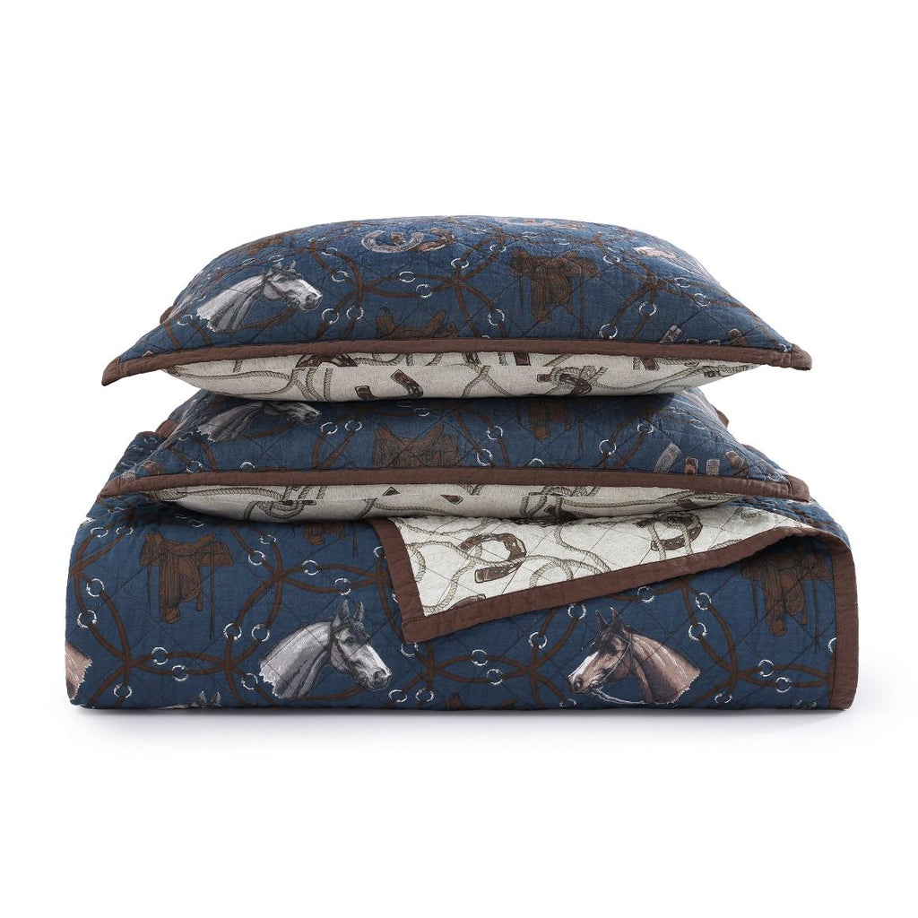 The quilt and matching shams folded together, showcasing the cohesive design and quality craftsmanship.