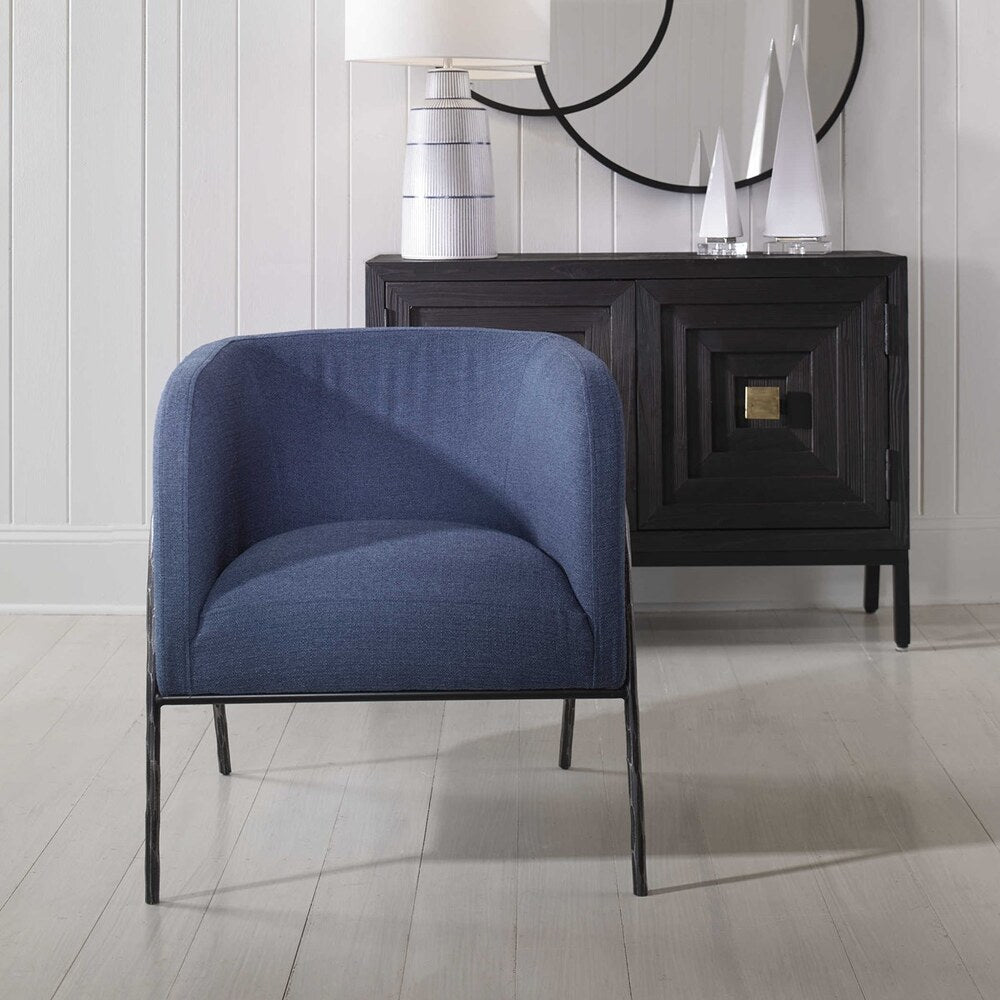 Elegant barrel back chair with blue polyester fabric and a natural aged black iron base.