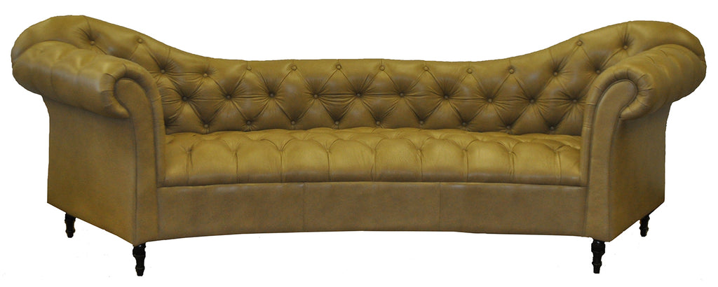 Brown leather sofa with scalloped tufted backrest and tufted seat on a white background