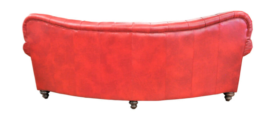 Back of red leather curved sofa on a white background
