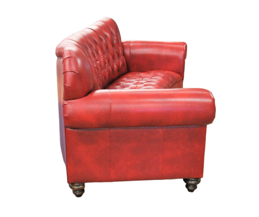 Side view of red conversational leather sofa on a white background