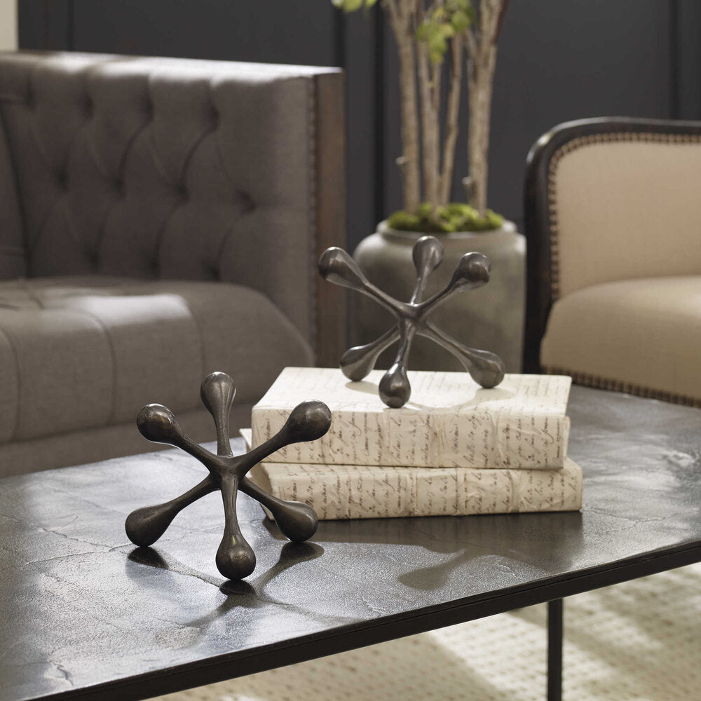 Set of black nickel decorative pieces featuring a smooth, polished finish and lasting elegance.