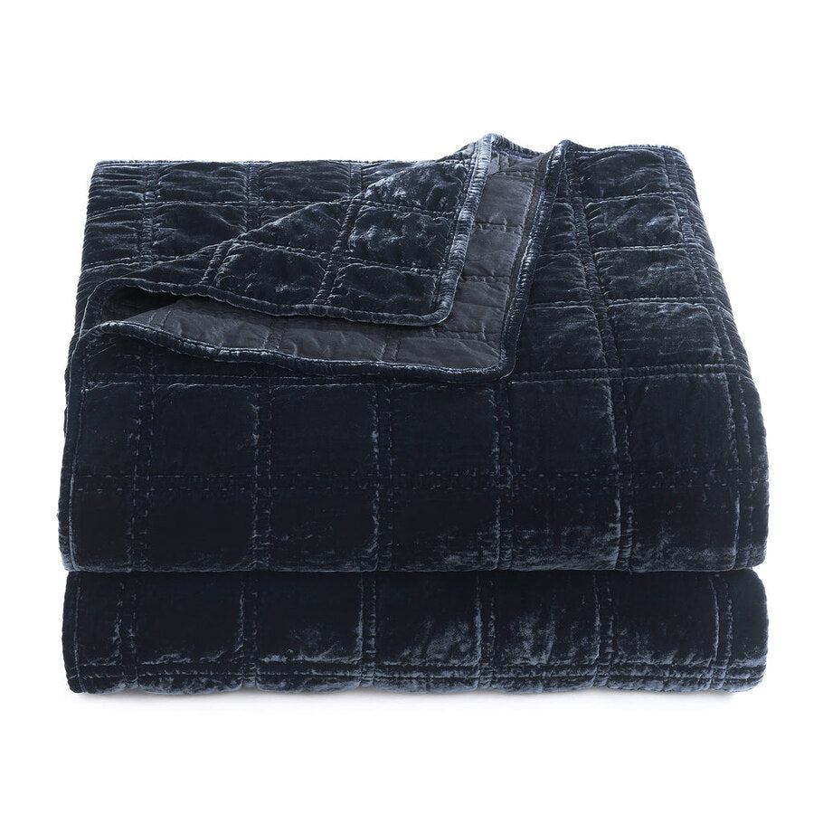 Close-up showcasing the smooth, faux silk velvet fabric of the Midnight Blue Quilt, offering a luxurious feel and subtle sheen.