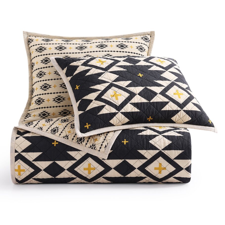 Sonoran Desert Reversible Quilt Set displayed with matching pillow shams, highlighting the cohesive design and craftsmanship.