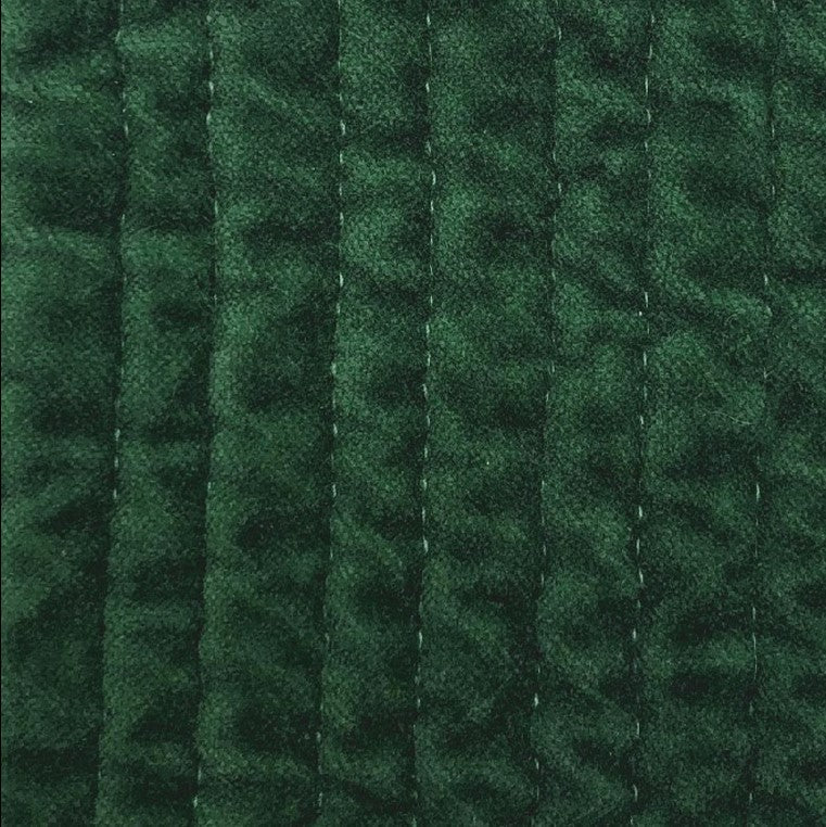 Close-up of the Stonewashed Emerald Cotton Velvet Quilt, highlighting the plush velvet texture and detailed channel stitching.
