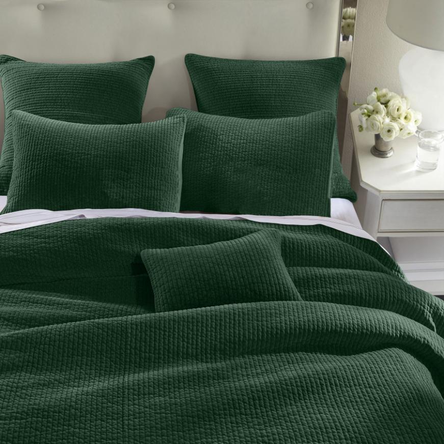 Stonewashed Emerald Cotton Velvet Quilt Set, featuring soft cotton velvet fabric with channel quilting, displayed on a bed with matching pillow shams.