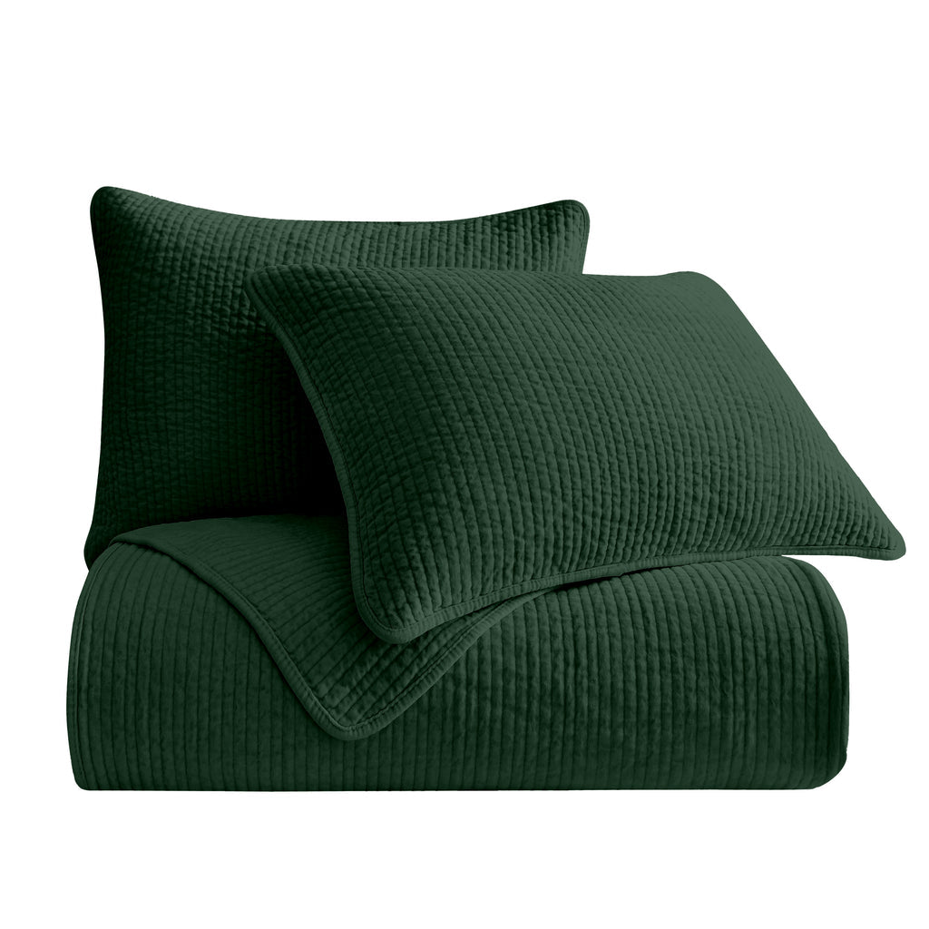Stonewashed Emerald Cotton Velvet Quilt Set, featuring soft cotton velvet fabric with channel quilting, displayed on a bed with matching pillow shams.