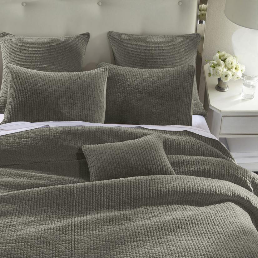 Stonewashed Fern Green Cotton Velvet Quilt Set, featuring soft cotton velvet fabric with channel quilting, displayed on a bed with matching pillow shams.
