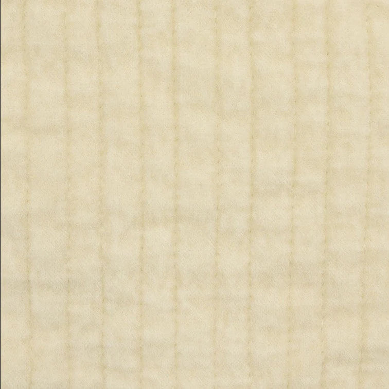 Close-up of the Stonewashed Light Tan Cotton Velvet Quilt, highlighting the plush velvet texture and detailed channel stitching.