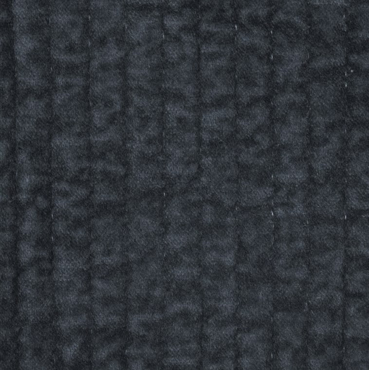 Close-up of the Stonewashed Navy Cotton Velvet Quilt, highlighting the plush velvet texture and detailed channel stitching.