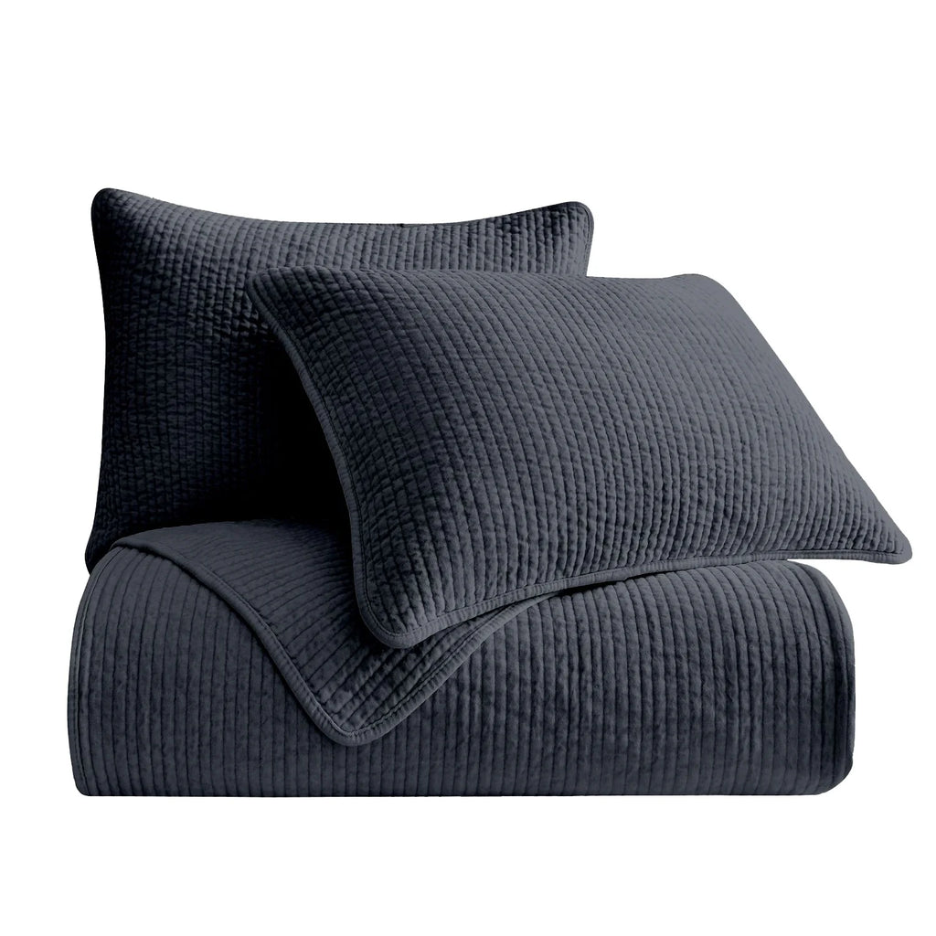Pair of Stonewashed Navy Cotton Velvet Pillow Shams, featuring matching channel quilting and soft velvet fabric.