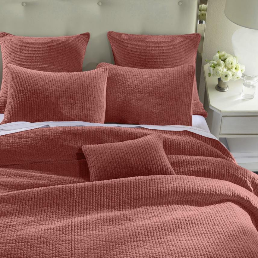 Stonewashed Salmon Cotton Velvet Quilt Set, featuring soft cotton velvet fabric with channel quilting, displayed on a bed with matching pillow shams.