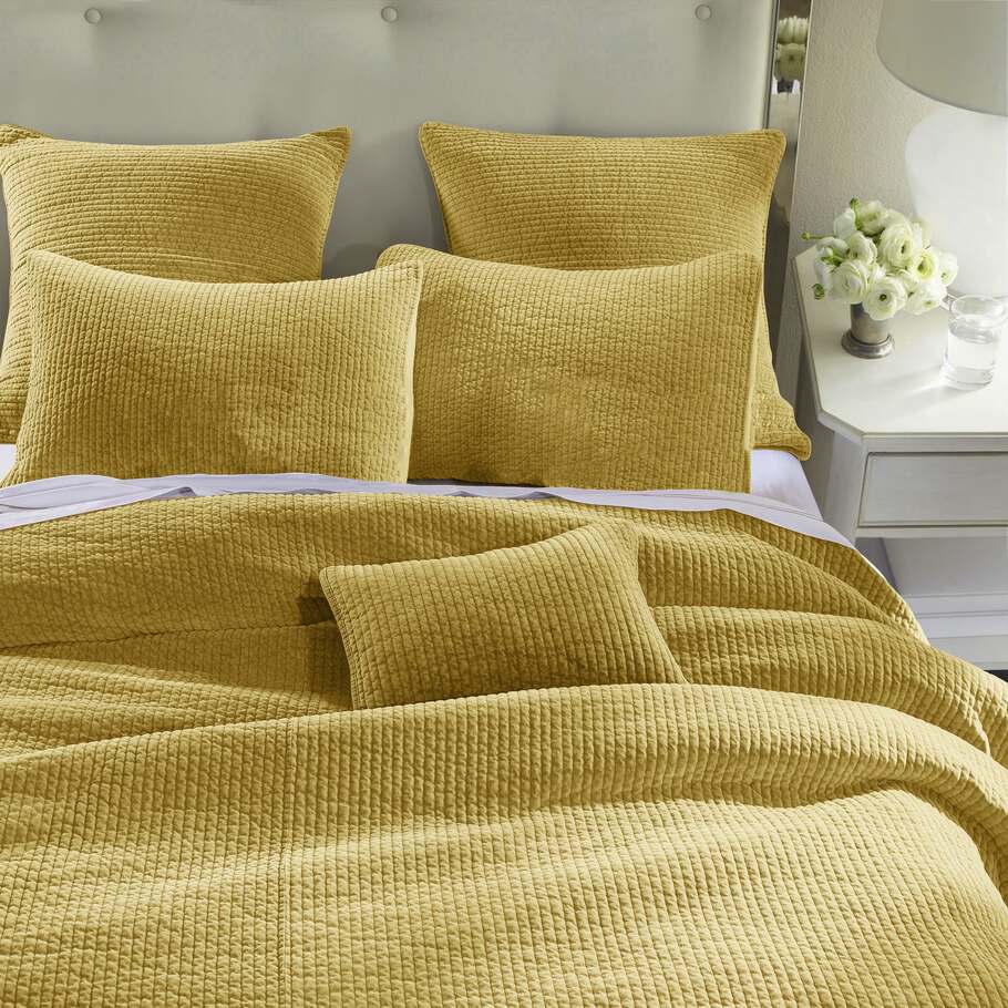 Stonewashed Tuscan Cotton Velvet Quilt Set styled in a cozy bedroom, complemented by neutral decor and natural lighting to emphasize its inviting warmth.